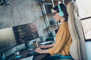 Profile side view portrait of attractive cheery girl editing data interface operating system...