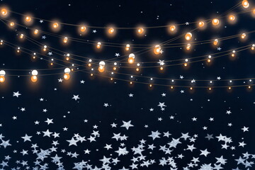 Naklejka premium Christmas Bokeh festive snowflakes bokeh garland light on dark background holiday blue yellow white template banner greetings card