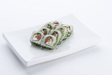 Sushi set and composition at white background. Japanese food restaurant, sushi maki gunkan roll plate or platter set.