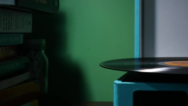Side view of a vinyl record playing.