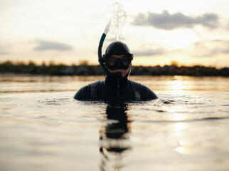 Young man snorkeling in the sea