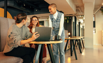 Group of businesswomen working together in an office lobby