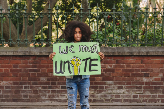 Black teenage girl campaigning for unity