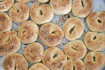 Top view close-up freshly baked pastry with sesame in the oven.