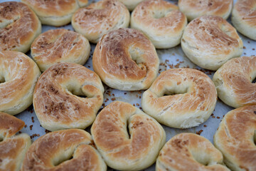 Top view close-up freshly baked pastry with sesame in the oven.