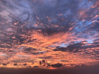 Abstract nature cloud background. Dramatic and moody pink, magenta, orange and little bit of blue clouds sunset sky