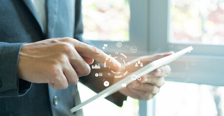 close up employee man hand hold digital let and using future business program application to connect with team or check system for  data development concept	
