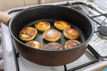 Cottage cheese pancakes or curd fritters. sirniki. Breakfast with cheesecake, fresh berries. food concept