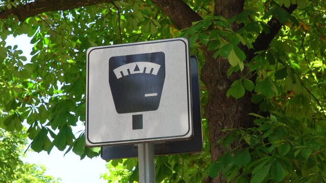 Parking meter information sign. Paid parking zone - information. Paid parking.