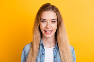 Portrait of positive cheerful lady toothy smiling looking in camera isolated blue color background