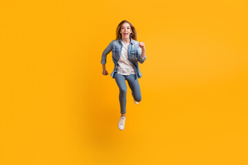 Fototapeta na wymiar Full size photo studio of active lady jump high hurry fast isolated vivid shine color background