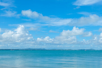 Obraz na płótnie Canvas Turquoise sea background with blue sky fluffy cloud nature landscape