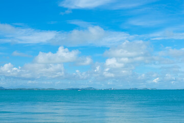 Naklejka na ściany i meble Turquoise sea background with blue sky fluffy cloud nature landscape