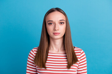 Fototapeta premium Portrait of yong woman casual portrait beautiful model posing in studio over blue background