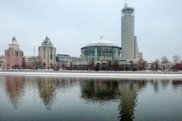Kosmodamianskaya embankment of the Moskva River on a foggy winter morning. Swissotel Krasnye Holmy Hotel, Moscow International House of Music and a complex of modern buildings