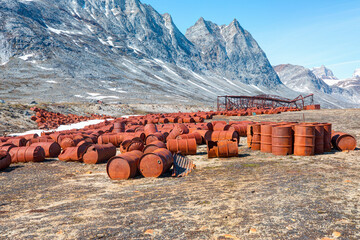 An abandoned US military base litters - Thousands of oil drums scattered across the land,  Greenland
