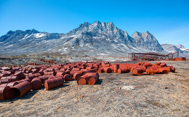 An abandoned US military base litters - Thousands of oil drums scattered across the land,  Greenland
