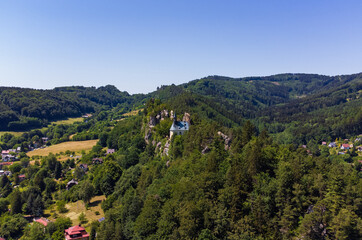Fototapeta premium Aerial view of ruin of Vranov Castle built on the steep rock cliff in Mala Skala, Czechia