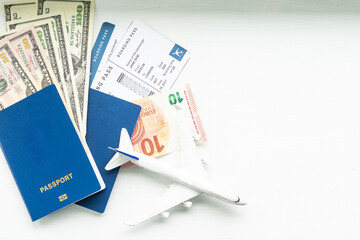 Preparation for Traveling concept, toy airplane, passport with copy space