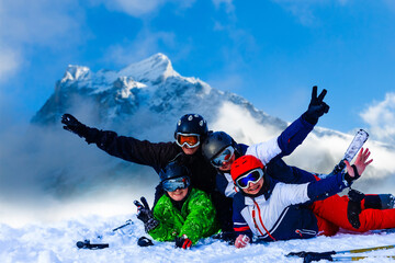 Smiling ski friends skiing alps resort