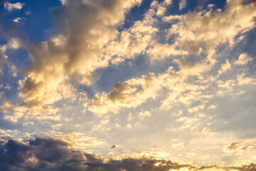 Naklejka na ściany i meble Multicolor clouds at sunset - dramatic sky