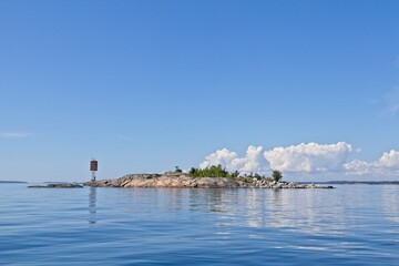 Navigational marker on rocky island of Pitkärivi, Helsinki, Finland.