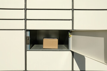 Open box with package in parcel locker