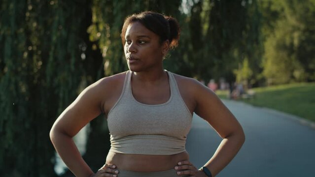 Focus woman breathing after the running at the park  
