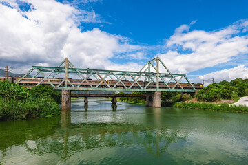 Train pass the iron bridge at dongshan river eco park in yilan, taiwan