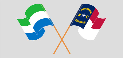 Crossed and waving flags of Sierra Leone and The State of North Carolina