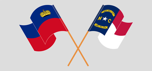 Crossed and waving flags of Liechtenstein and The State of North Carolina