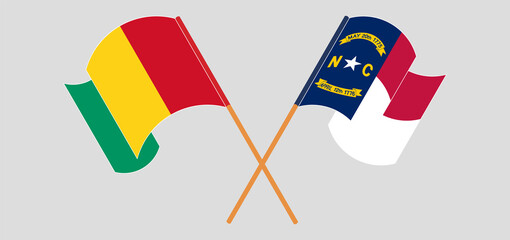 Crossed and waving flags of Guinea and The State of North Carolina