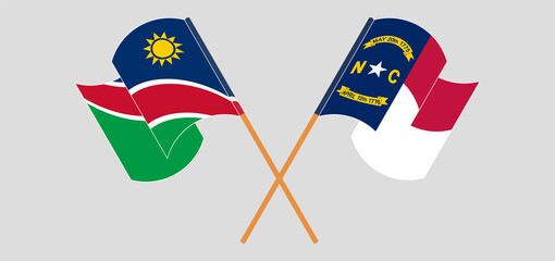 Crossed and waving flags of Namibia and The State of North Carolina