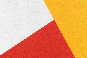 Fototapeta na wymiar Texture of craft white, yellow and red shade color paper background, macro. Structure of vintage abstract cardboard