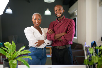 Two Black co-founders pose with arms crossed with their new business
