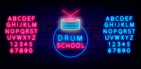 Drum school neon label on brick wall. Drum kit in circle frame. Shiny blue and pink alphabet. Vector illustration