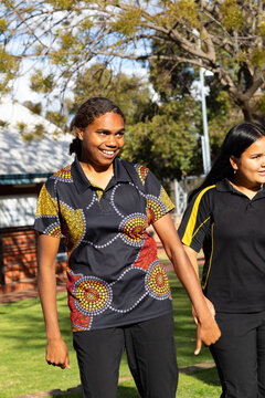 teenager in aboriginal print polo shirt with friend