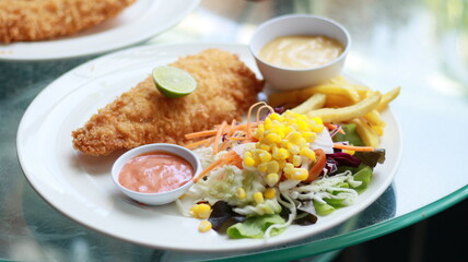 fish steak salad french fries lunch
