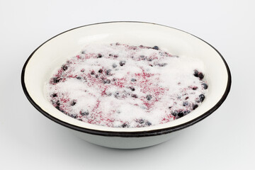 Blueberries dusted with sugar to make homemade jam.