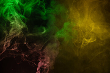 Yellow and pink steam on a black background.