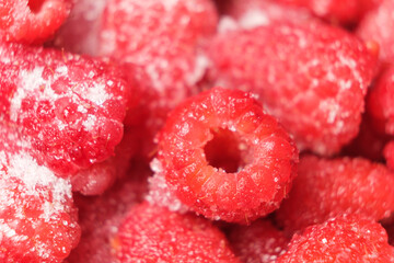 Raspberry with sugar close-up macro, top view.