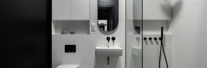 Modern black and white bathroom, panorama