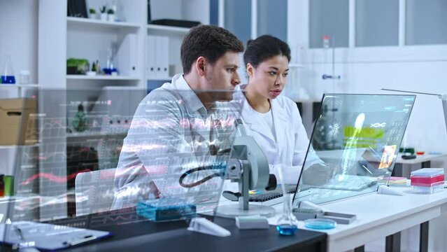 Scientists working in modern medical lab, holographic human skeleton on screen