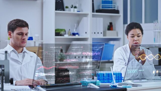 Sad genetic lab workers looking at experiment failure statistics on computer