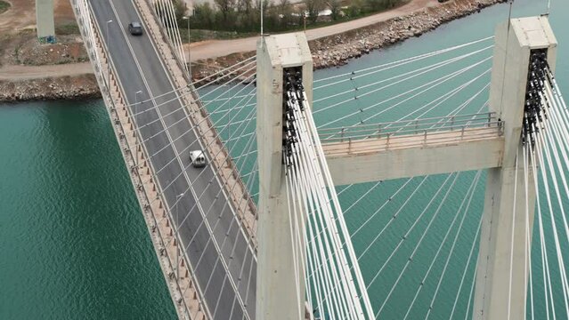 Aerial shot of the New Bridge of Chalkida in Greece. Slow clockwise orbit and cars passing by. Shot on DJI Inspire 2 X7 50mm RAW.