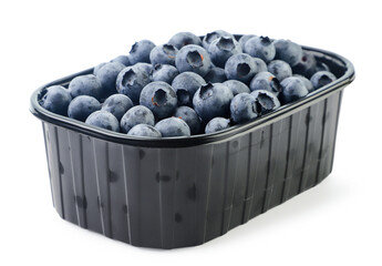 Blueberries in a plastic container on a white background. Isolated