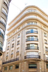 Fototapeta na wymiar Nice facade of old design building in the main avenue of the city