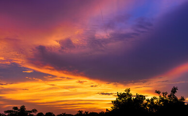 Dramatic colorful monsoon cloud formation in the sky during sunset