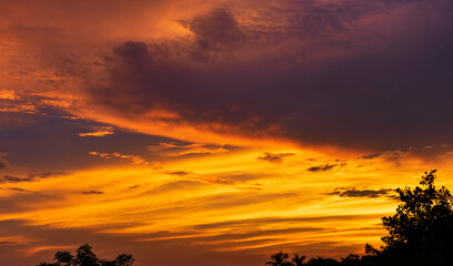 Dramatic colorful monsoon cloud formation in the sky during sunset