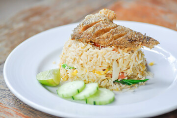 stir fried rice or fried rice with fried fish topping , fish and rice